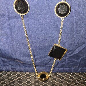 Women's golden chain necklace with large black stones
